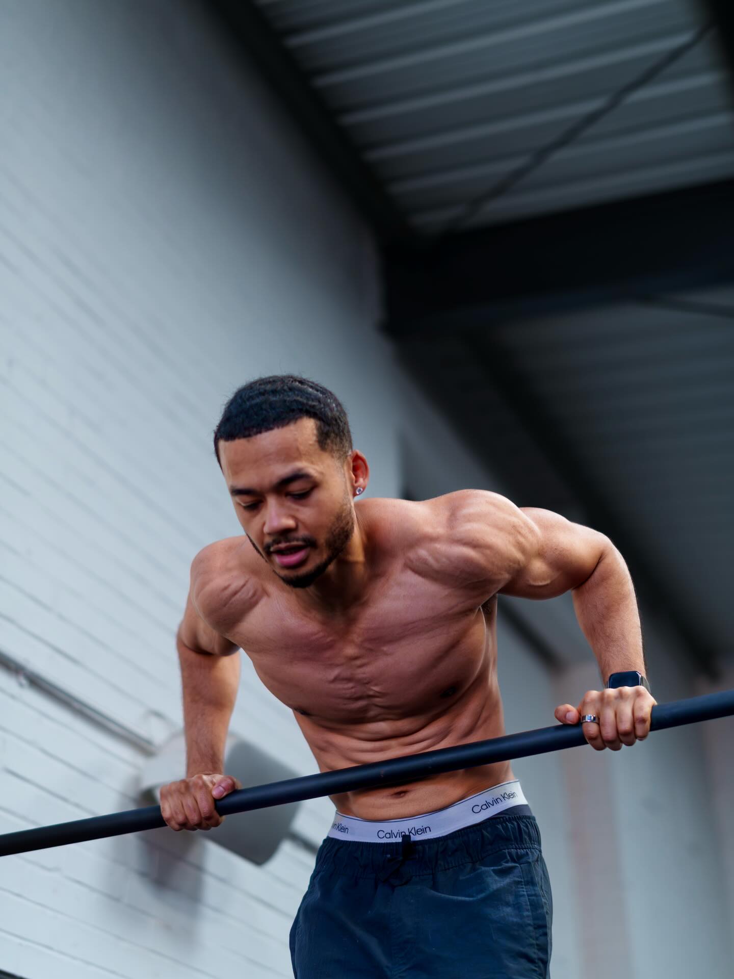 Nathan Lawrence performing a muscle-up