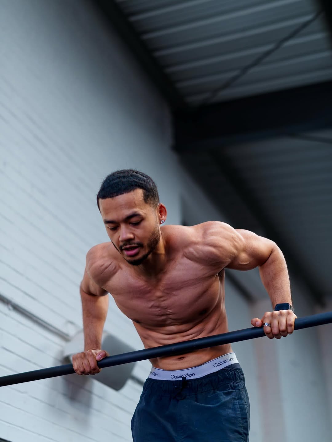 Nathan Lawrence performing a muscle-up